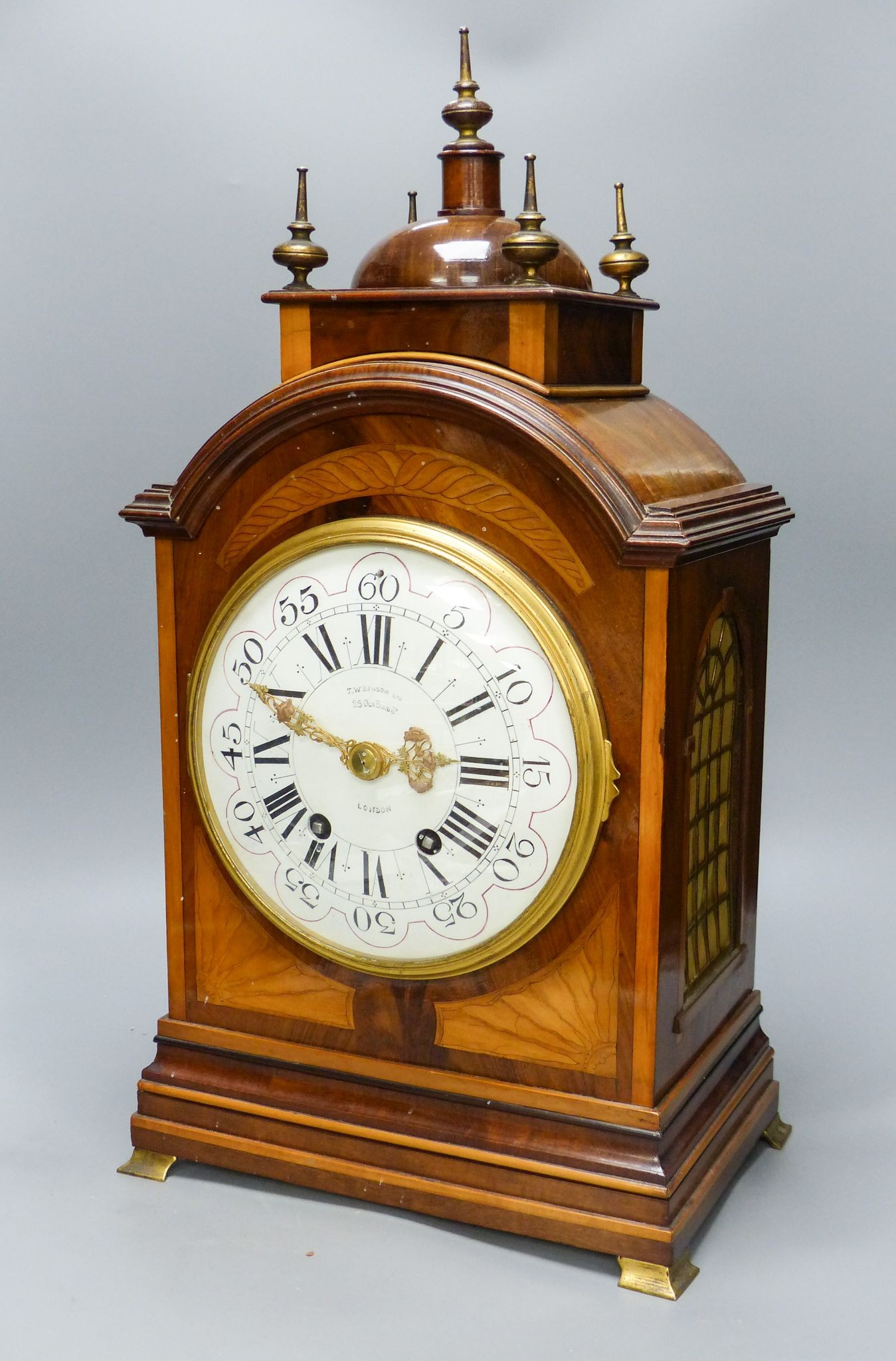 A French flame mahogany and satinwood banded bracket clock retailed by J.W Benson 56cm